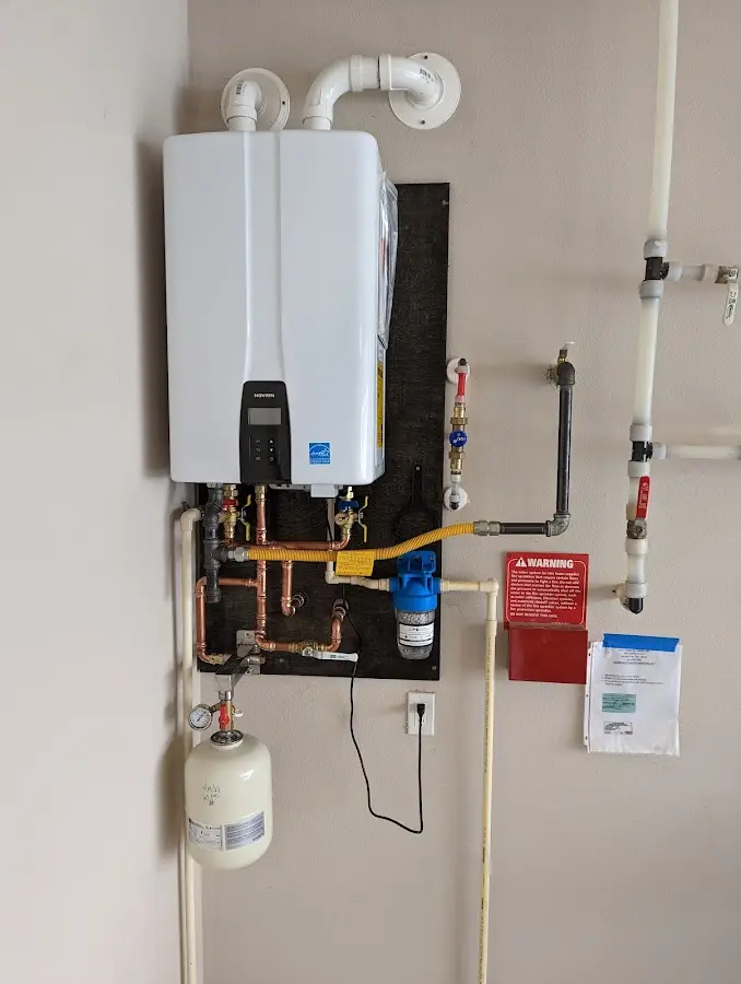 Professional plumber installing copper piping in a Walhalla home